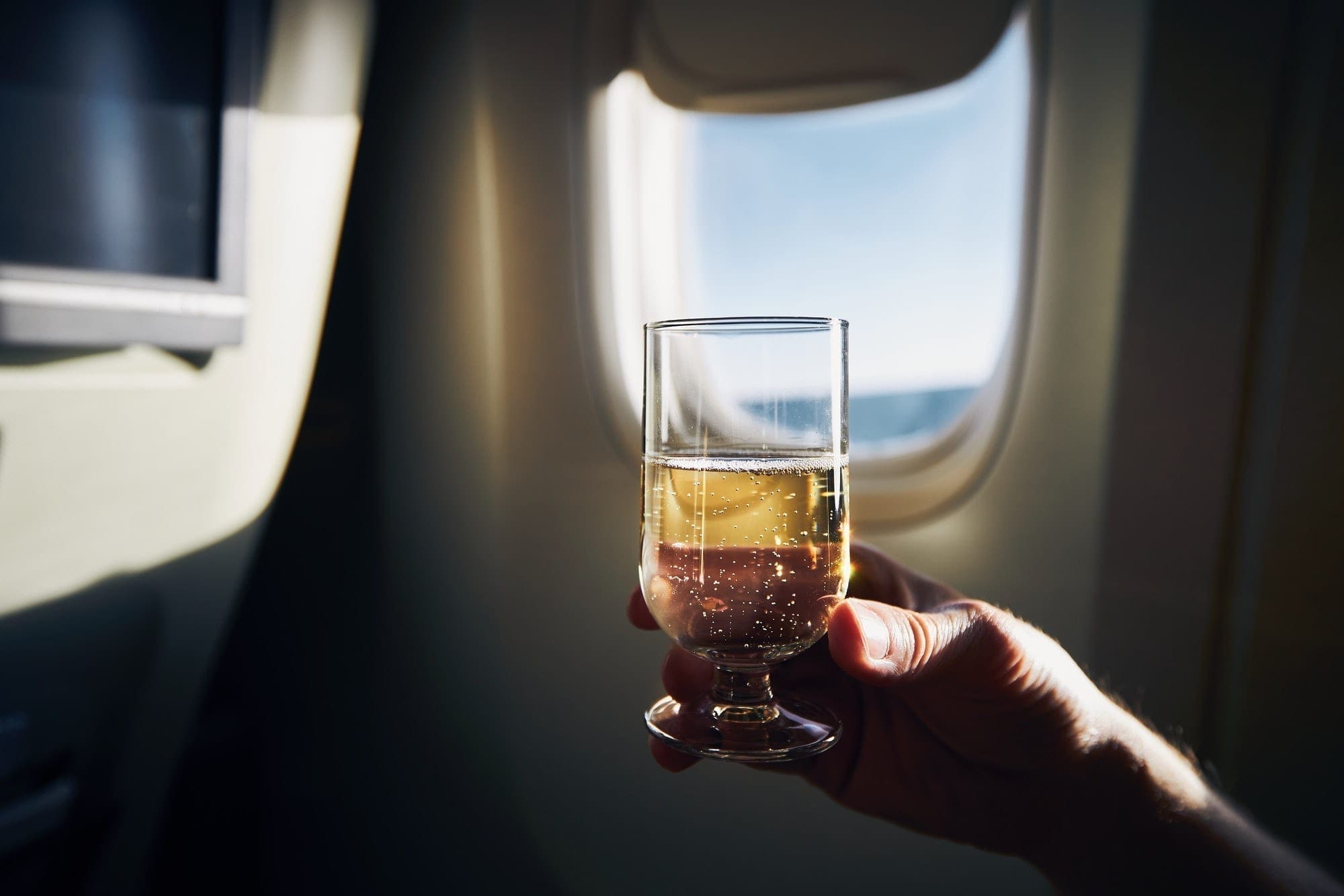 Glass of sparkling wine during flight
