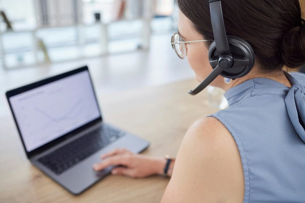 Call center, customer support and woman with laptop in office for networking, communication and crm